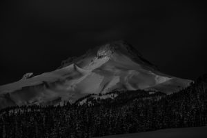 The slopes and undulations of Mount Hood at 4:30am by moon light.